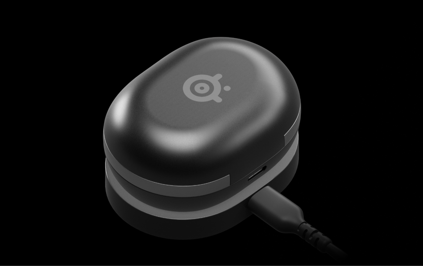 A photo showing the Gamebuds attached to the wireless charging device.