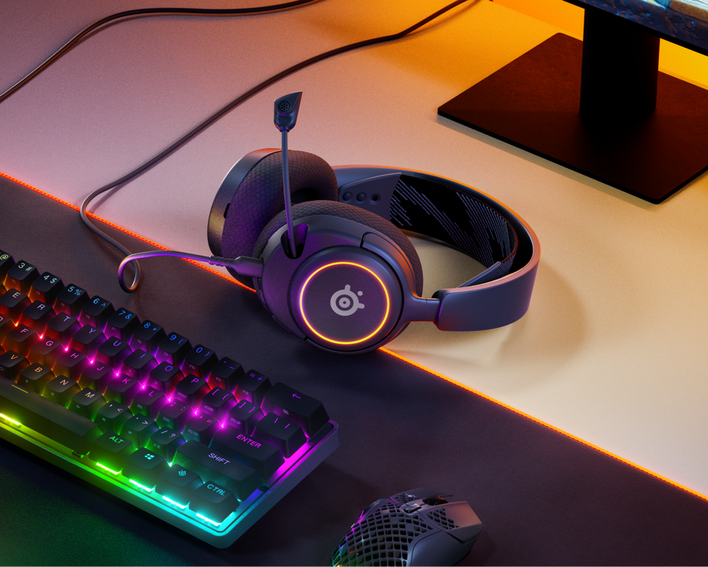 
 An Arctis Nova 3 headset against a desktop gaming setup.
 